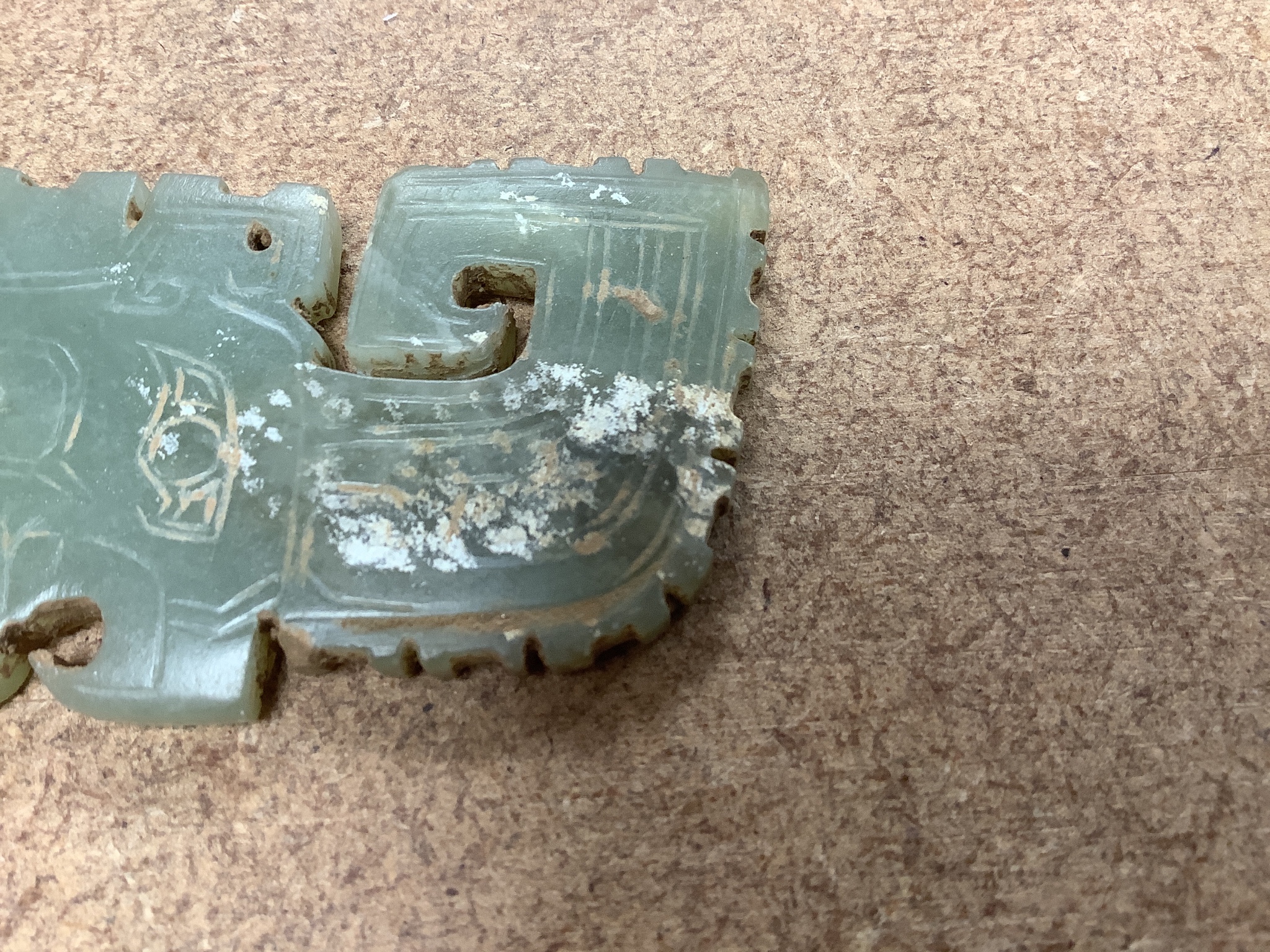 A Chinese archaistic green jade plaque, width 9cm